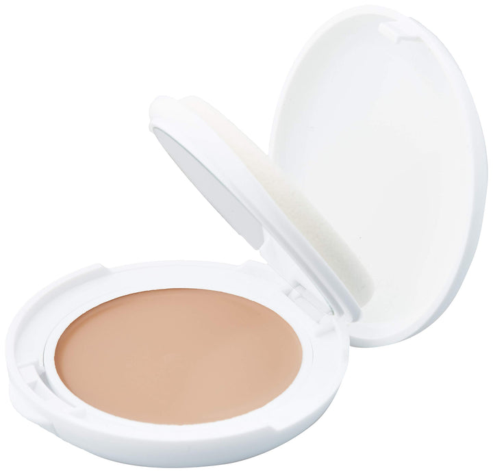 Compact cream foundation in gold case, SPF50, 10 g, sponge included