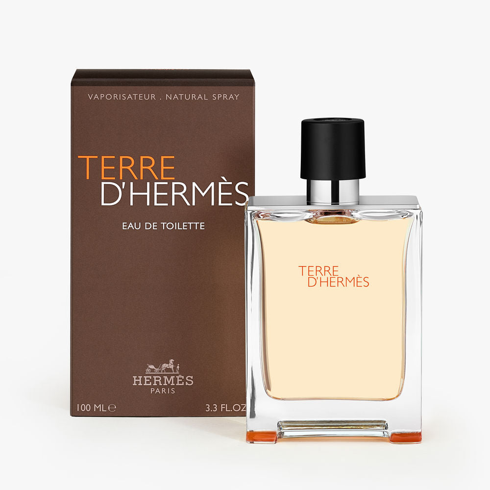 Rectangular glass bottle with metal shoulders; 100 ml woody-citrus perfume for Man
