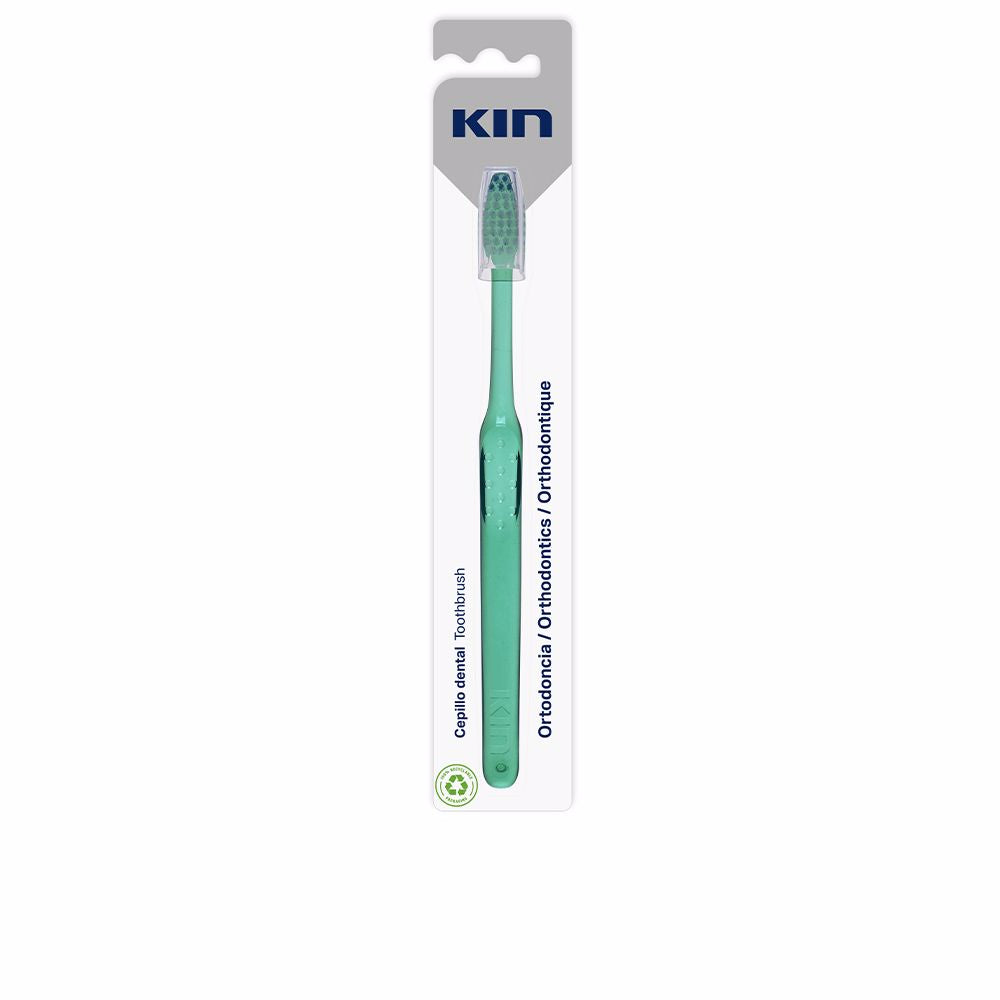 Compact triangular‑head orthodontic toothbrush with ergonomic handle and protective cap, Unisex