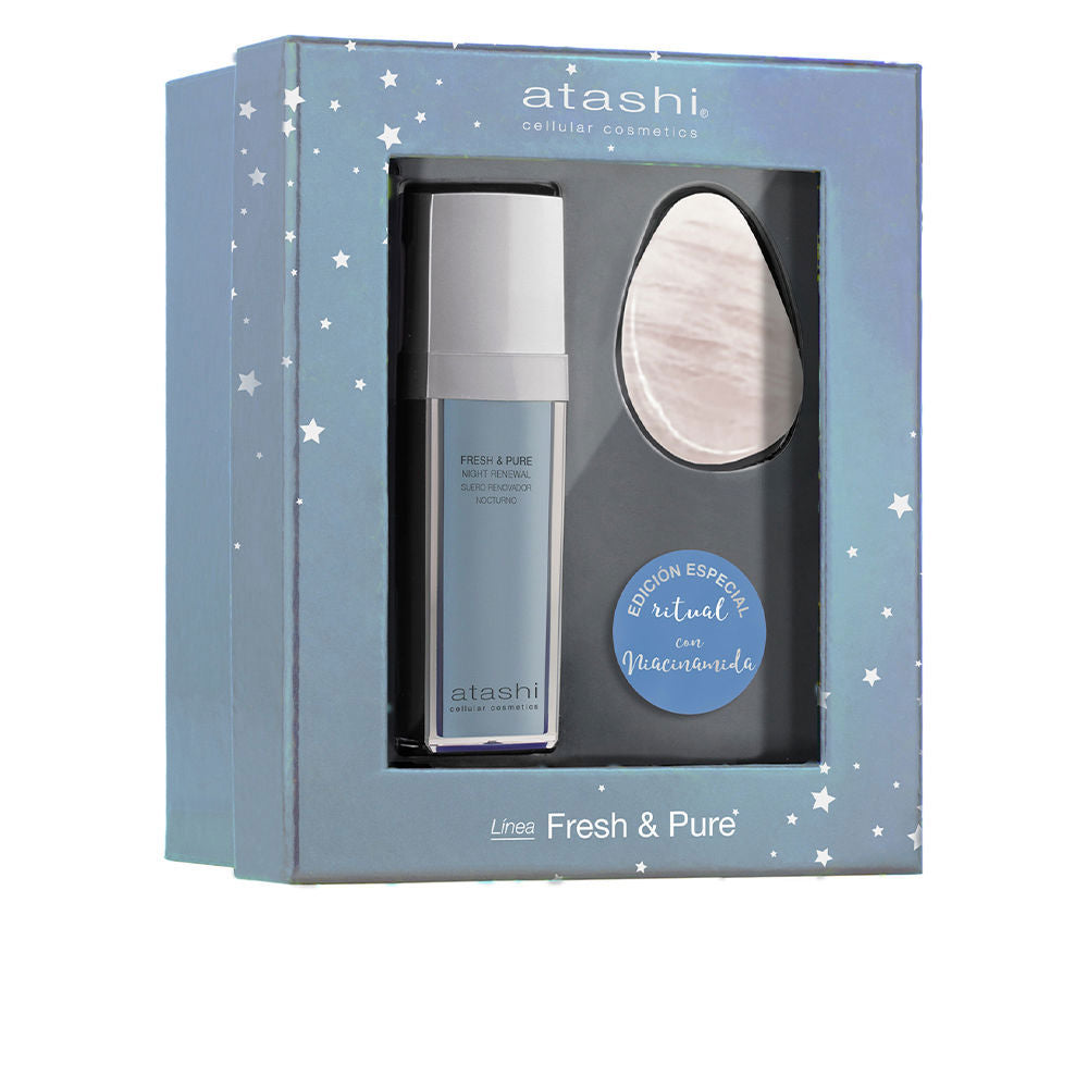 Atashi night renewal facial serum in blue rectangular plastic bottle with pump, box showing star pattern and transparent window