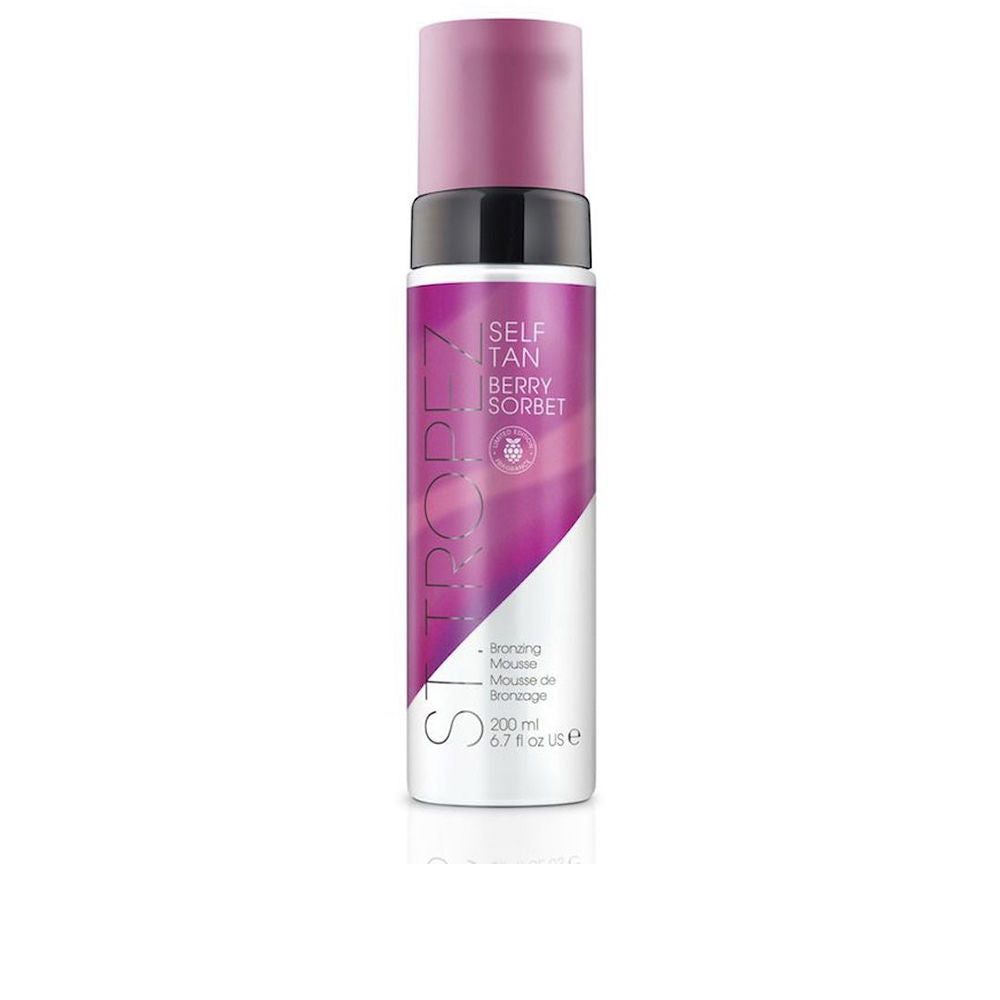 St.tropez Cylindrical plastic self‑tan mousse bottle with purple‑to‑white gradient, black pump, and text label
