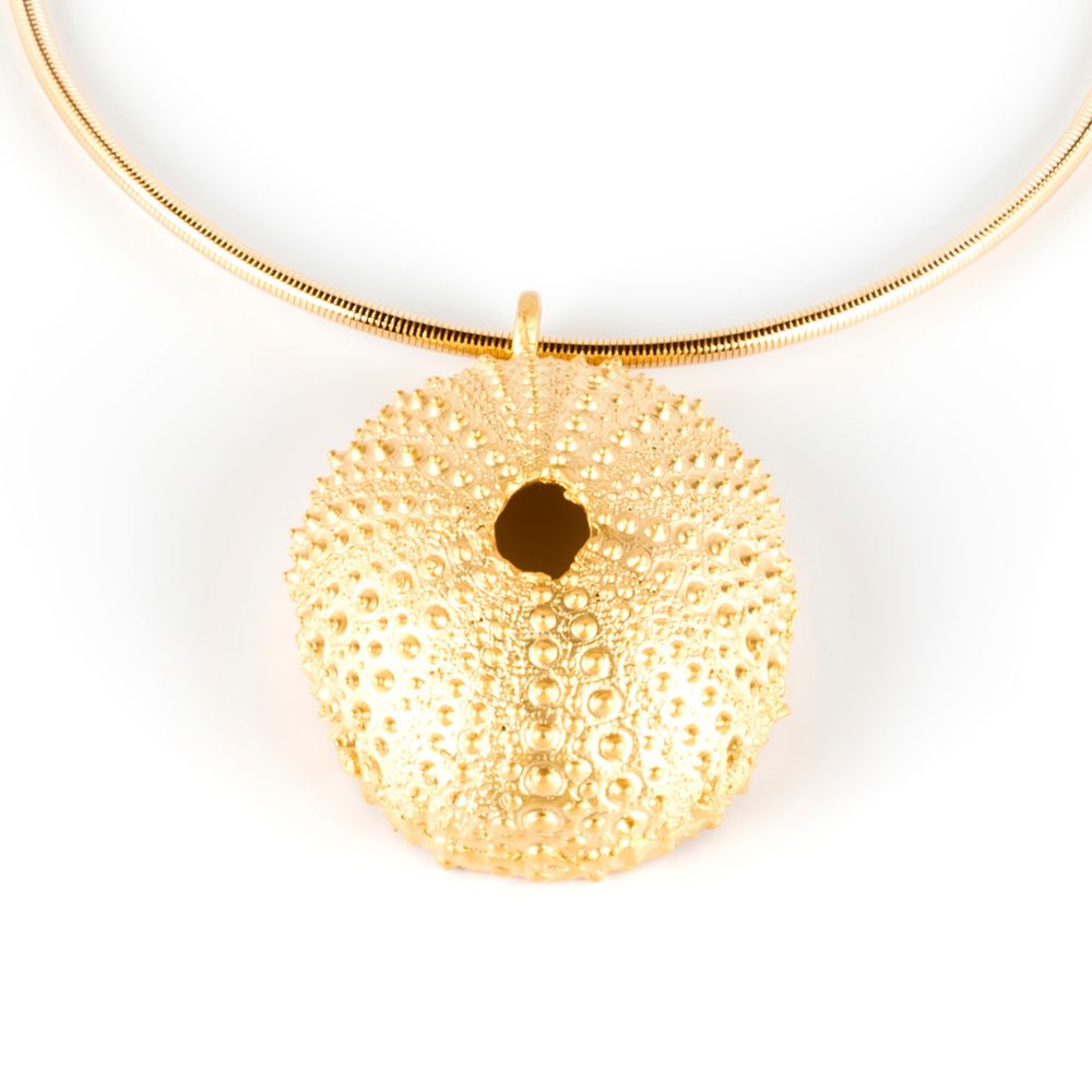 Gold‑tone sea‑urchin pendant on adjustable black nylon cord, 5 cm pendant