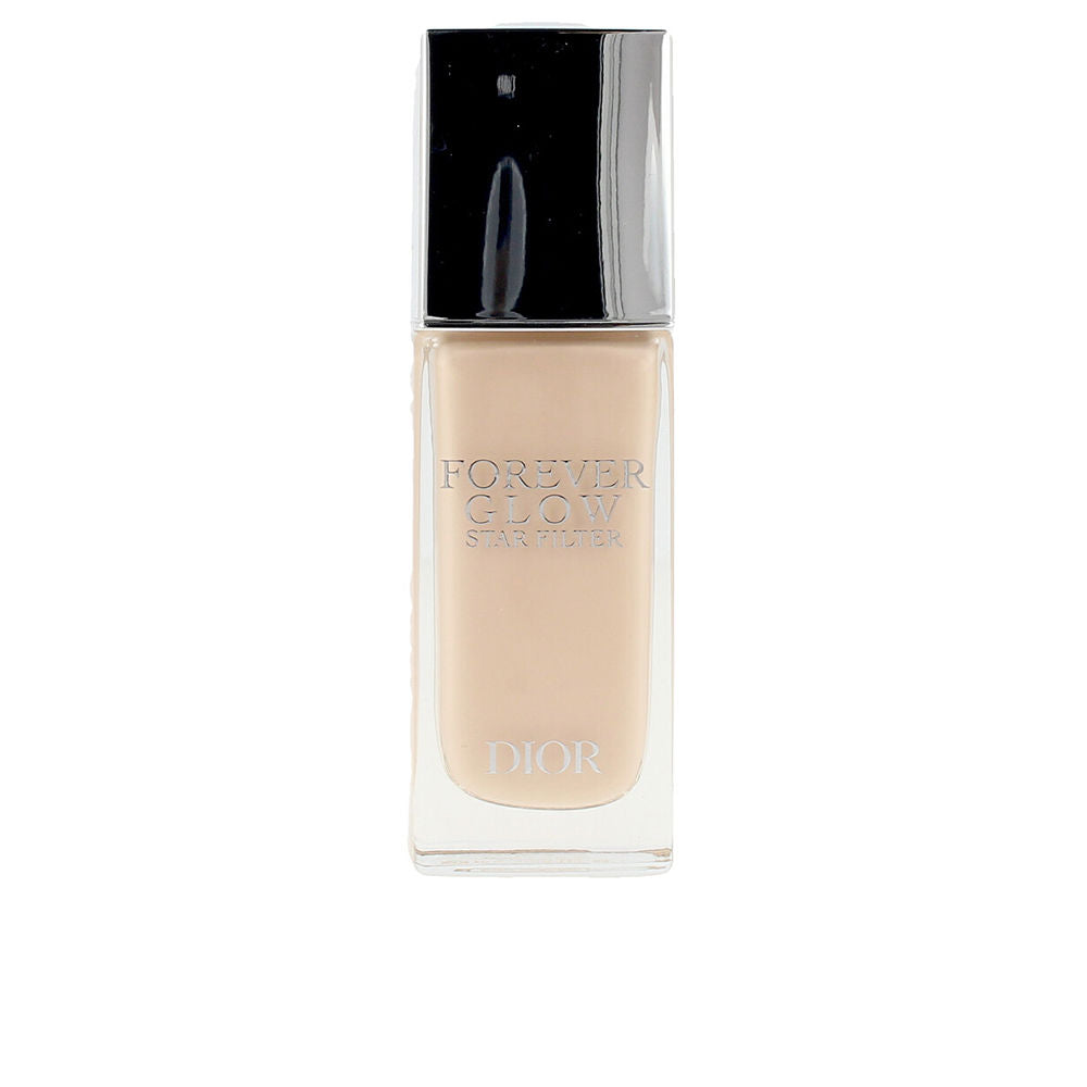 Pump bottle of lightweight luminous fluid, pale champagne shade, iris extract mention
