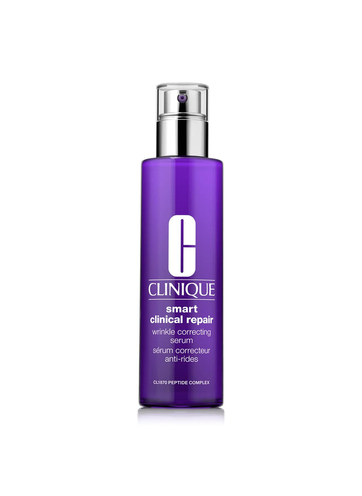Glass pump serum bottle, 75 ml, translucent with silvery cap on neutral background