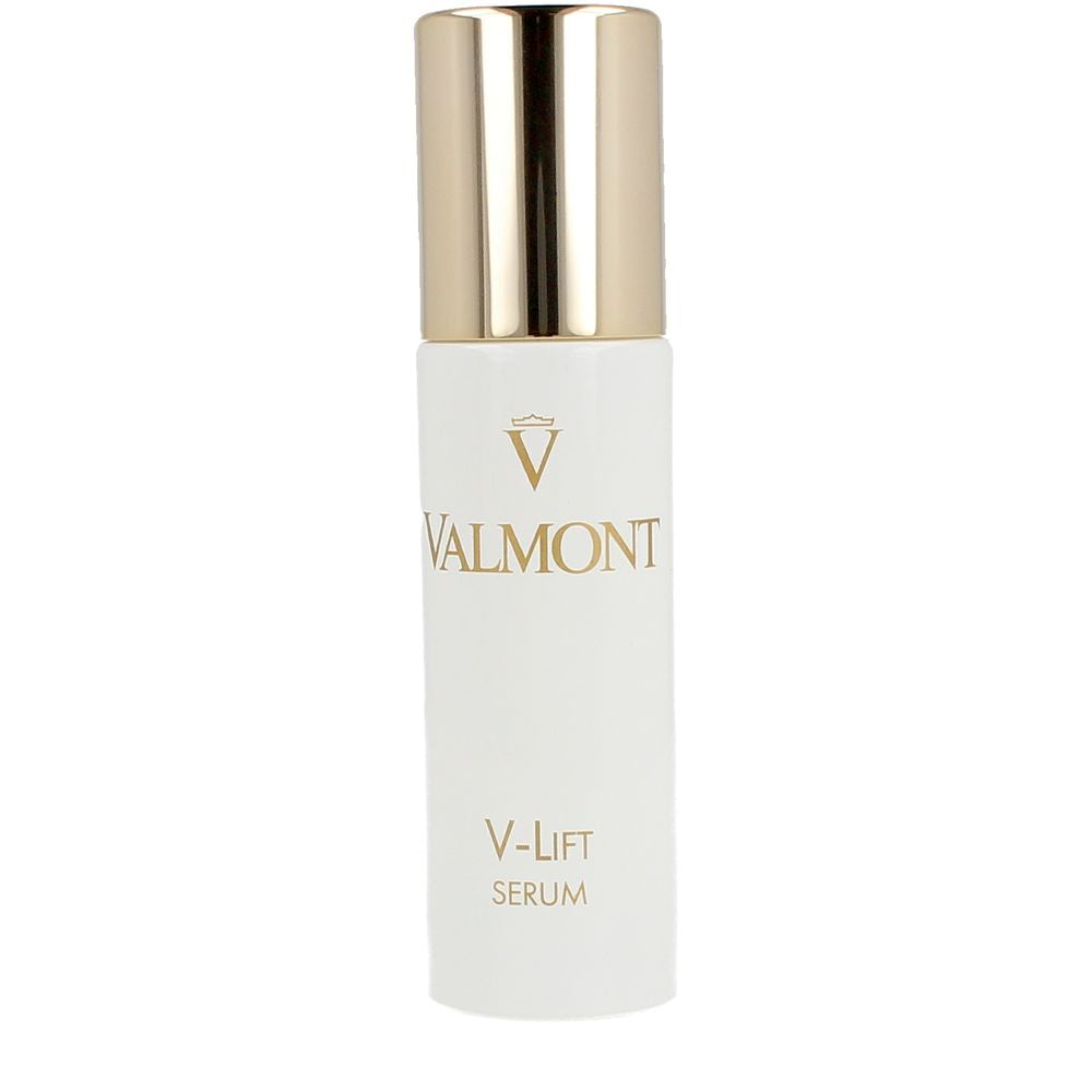 Valmont White cylindrical serum bottle with shiny gold metallic cap, minimalist elegant design, photographed with soft lighting for texture.