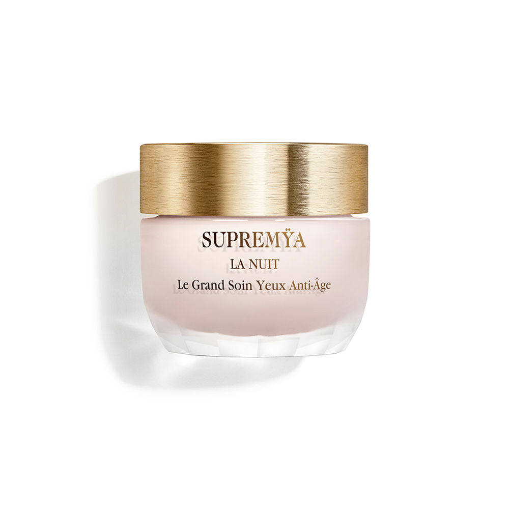 Elegant jar of Sisley Supremÿa La Nuit eye treatment against a neutral background