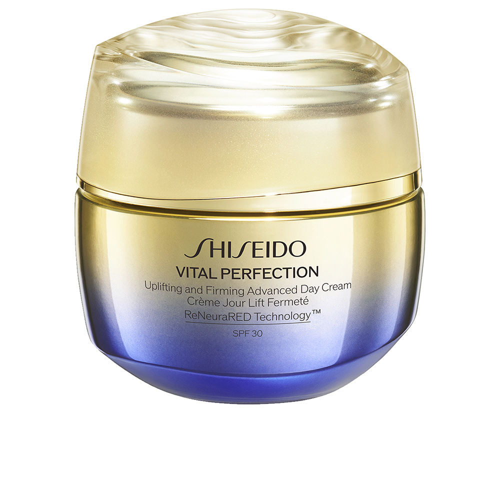 Shiseido Gold and blue gradient plastic cream jar with shiny finish, rounded container and twist-off lid
