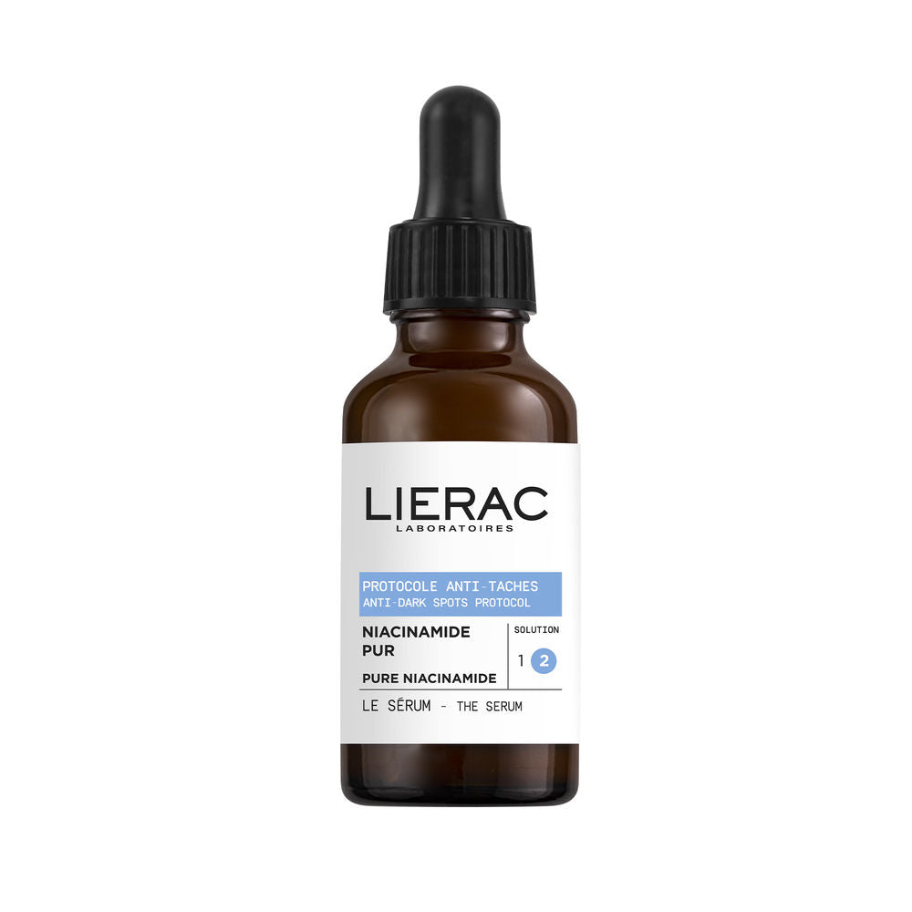 Lierac Glass mini serum bottle with white label, blue glass and yellow accents, plastic dropper cap