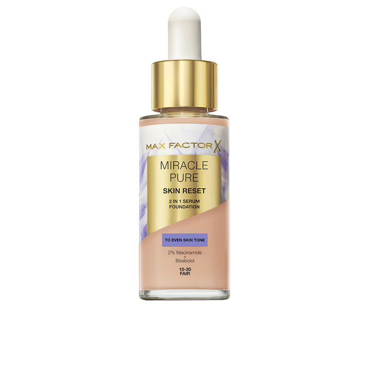 Max Factor Glass foundation bottle with dropper cap, transparent body, gold textured label, visible beige liquid