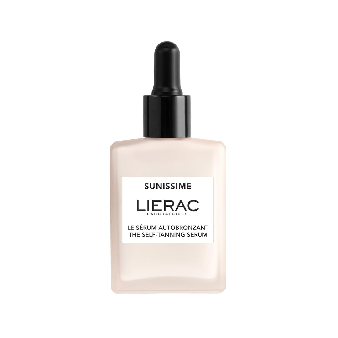 Lierac Glass dropper bottle of lightweight self-tanning facial serum, amber liquid visible, minimalist label