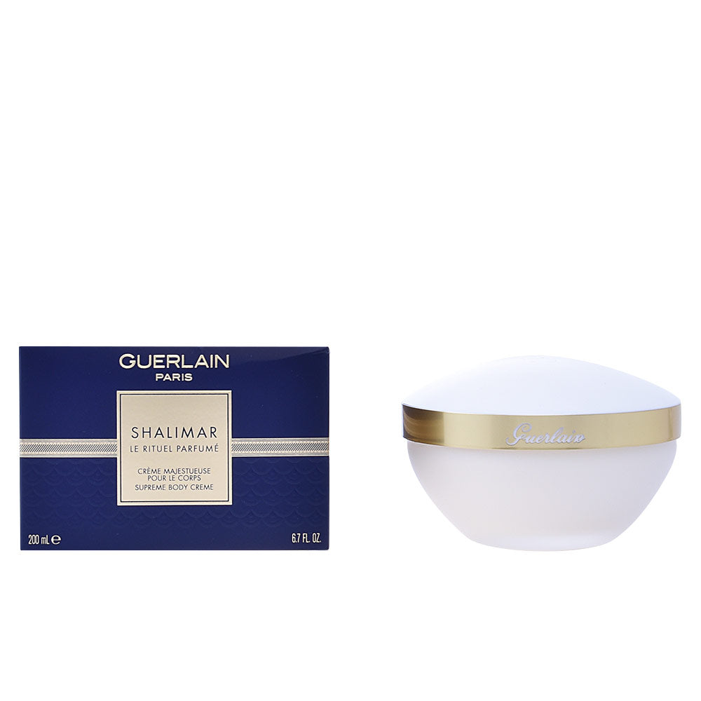 Navy blue and white boxed body crème in round jar with gold band and matching lid, Guerlain