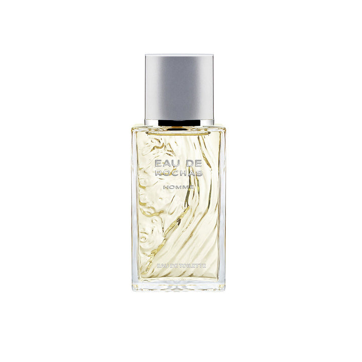 Sculptural clear bottle of Eau de Rochas Homme with fresh citrus-aromatic fragrance
