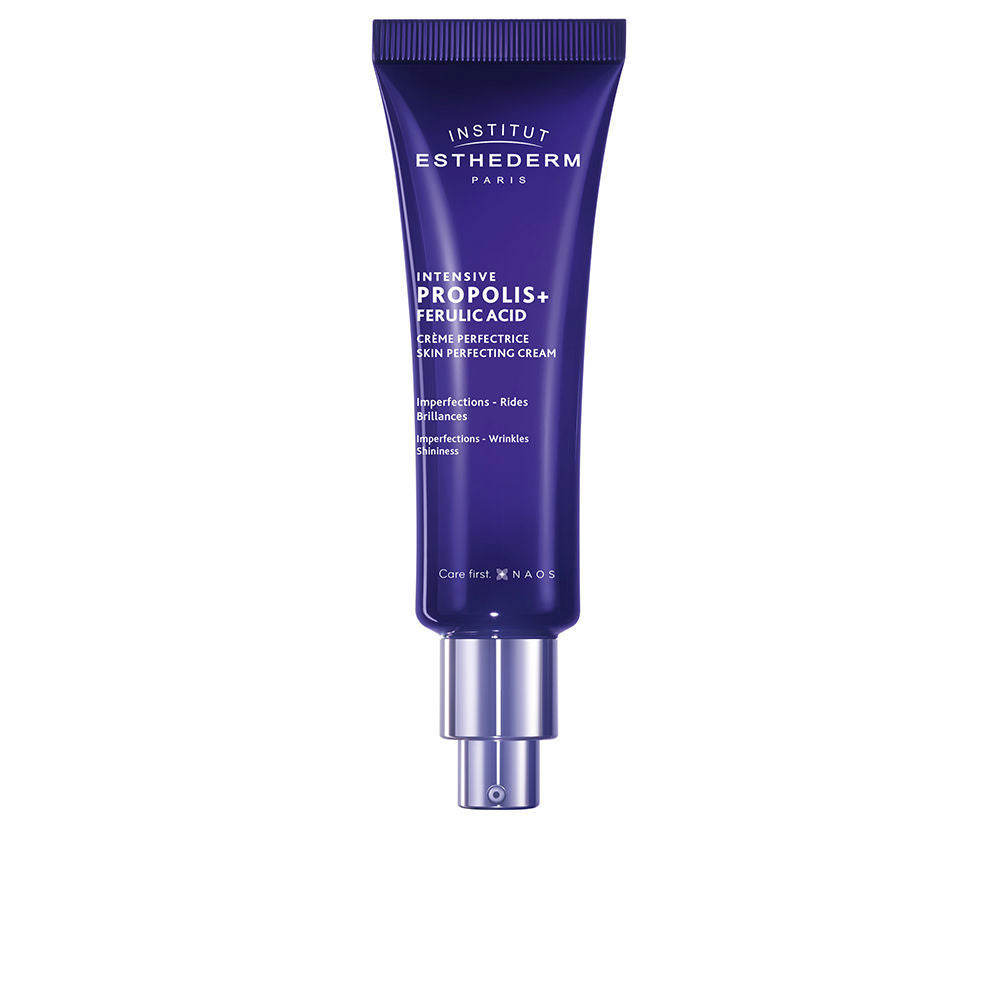 Institut Esthederm Dark blue plastic pump jar of blemish-correcting propolis cream, modern sleek design, brand