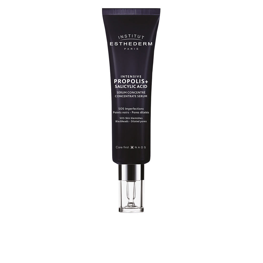 Institut Esthederm Black matte plastic serum tube with pump dispenser, white text printing and subtle tube seams
