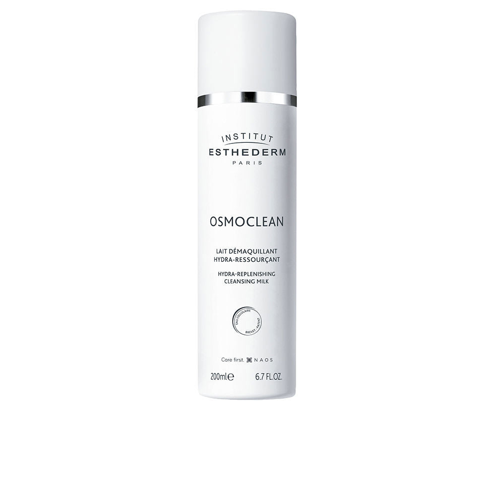 White plastic cleansing milk bottle with silver band, minimalist cylindrical silhouette, Institut Esthederm