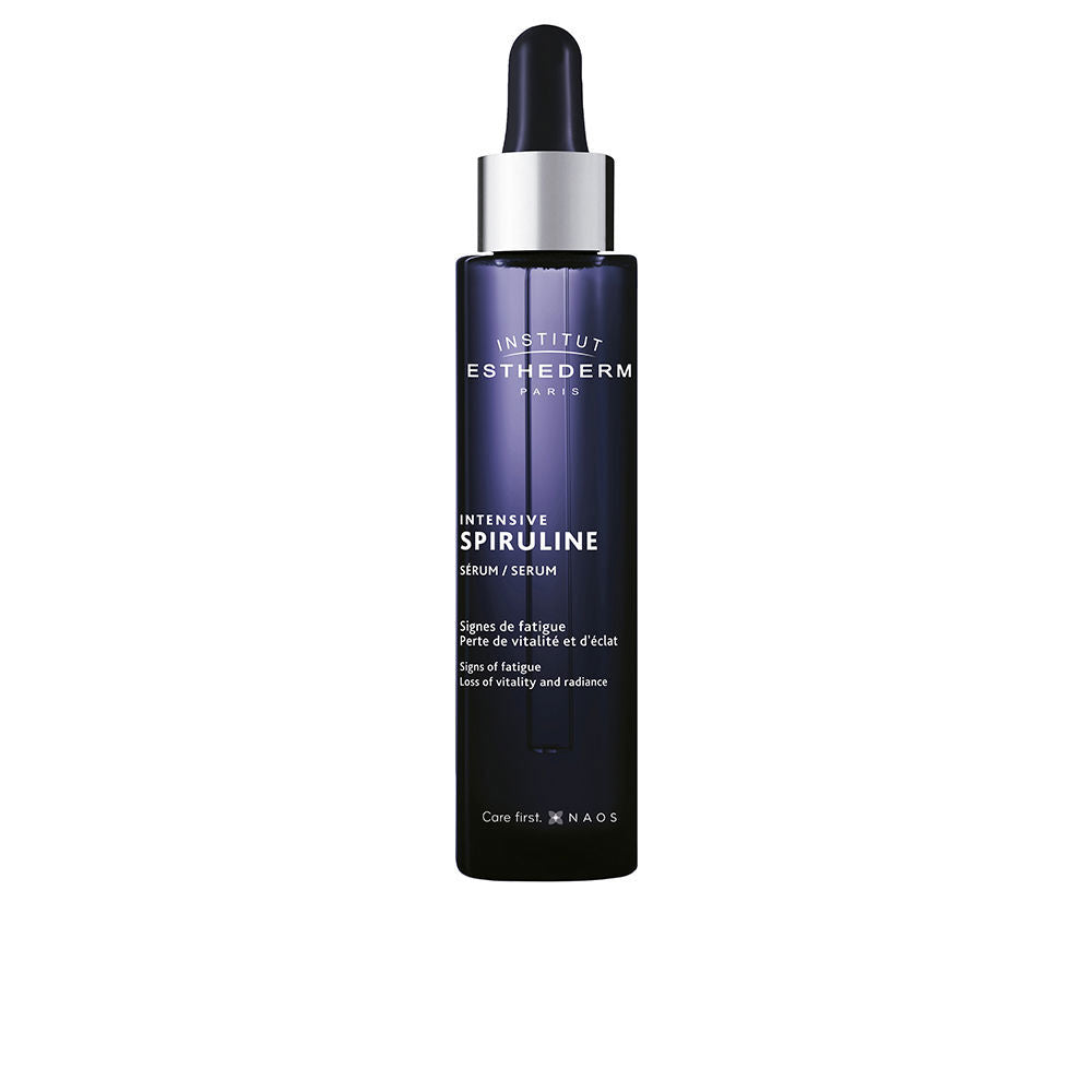 Institut Esthederm Dark blue glass cylindrical serum bottle with dropper cap, white text print and subtle gradient shading