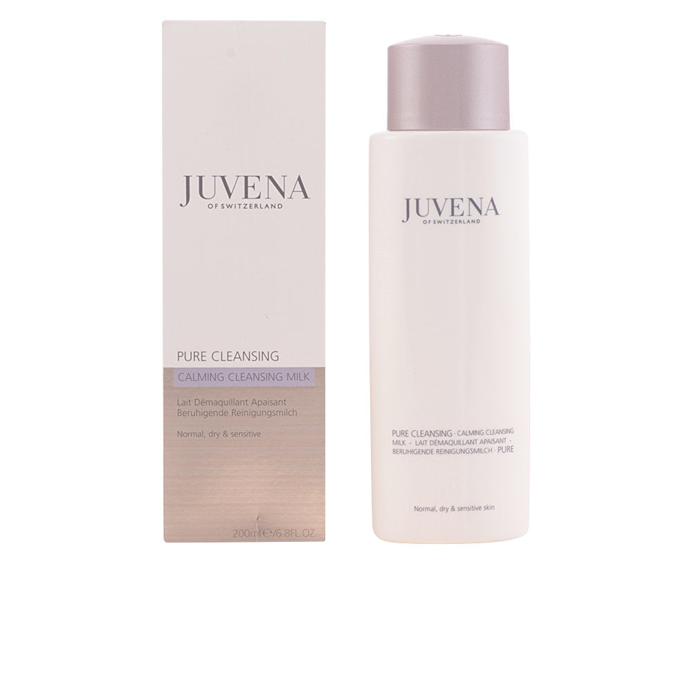 Juvena gentle cleansing milk in white bottle with cap beside light purple and beige rectangular box