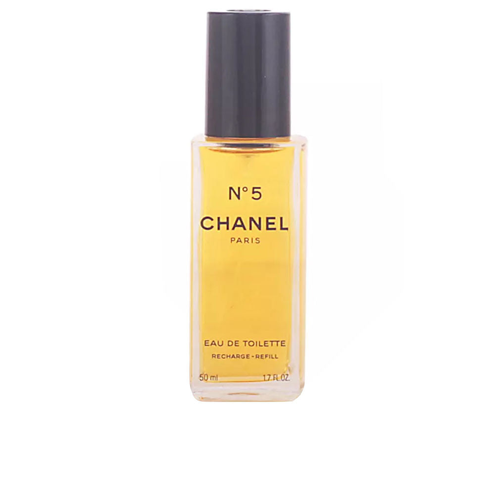 Chanel Glass rectangular eau de toilette bottle with black cap, printed text, clear yellow liquid