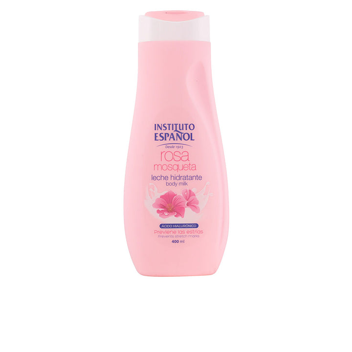 Instituto Español Soft pink plastic body lotion bottle with flip-top cap, floral graphic and clean text labels, smooth surface