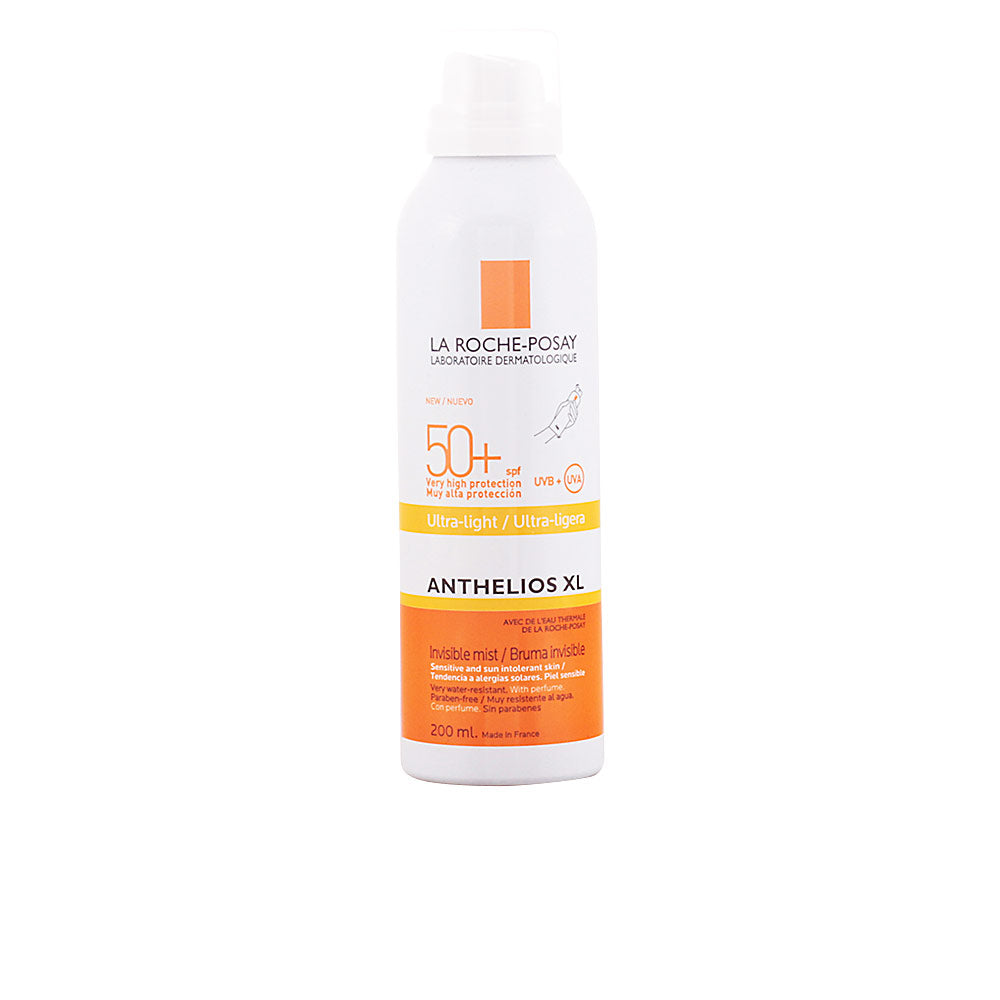 la Roche Posay White, orange and yellow cylindrical plastic sunscreen spray with spray nozzle, minimalist clinical design from