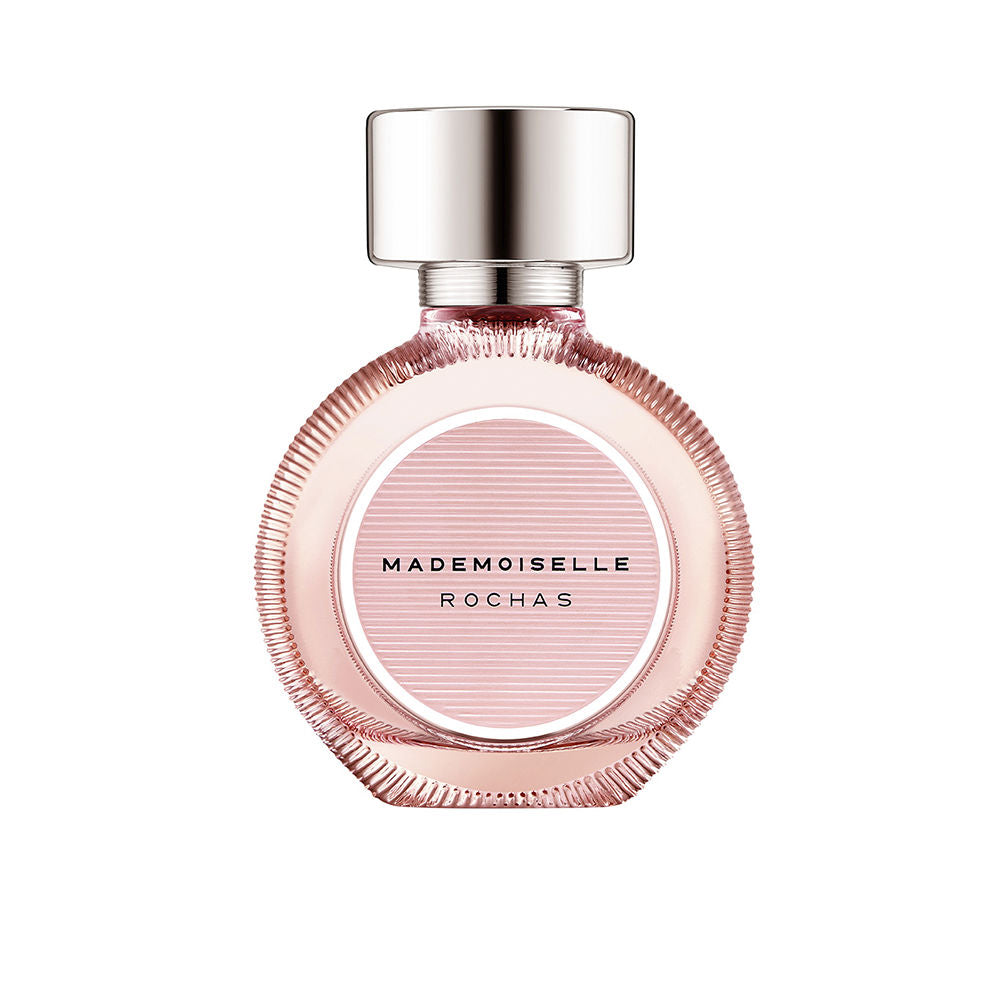 Rochas Glass round pink perfume bottle with metallic cap and white ribbon bow, elegant modern design