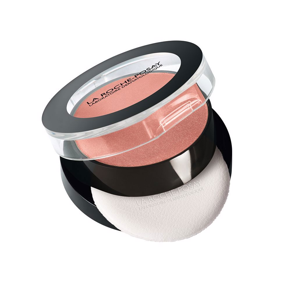la Roche Posay Compact modern plastic powder case with transparent lid, black trim, pink blush pan, puff