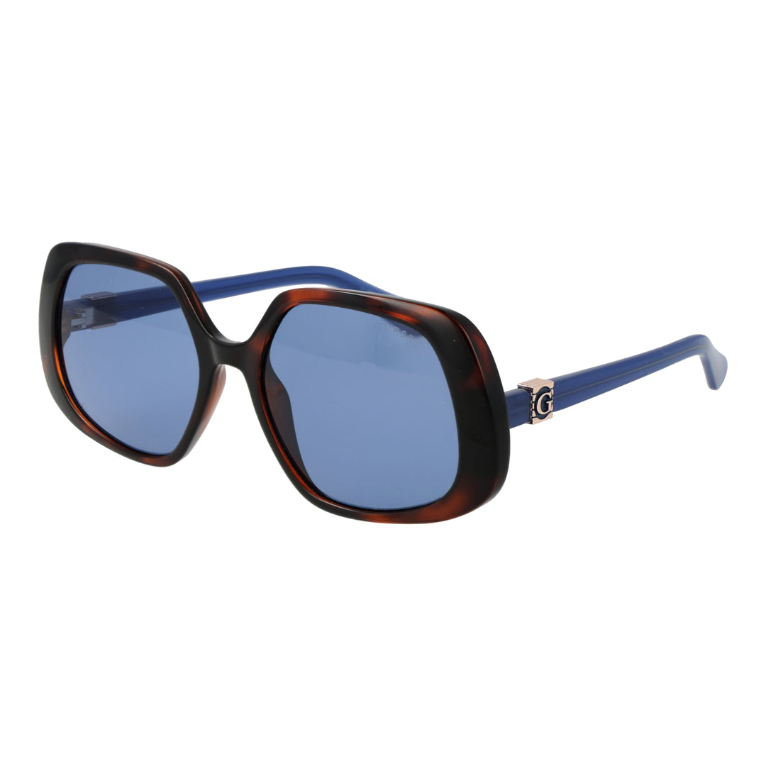 Tortoise shell oversized square sunglasses with blue-tinted lenses and logo temple detail on white background