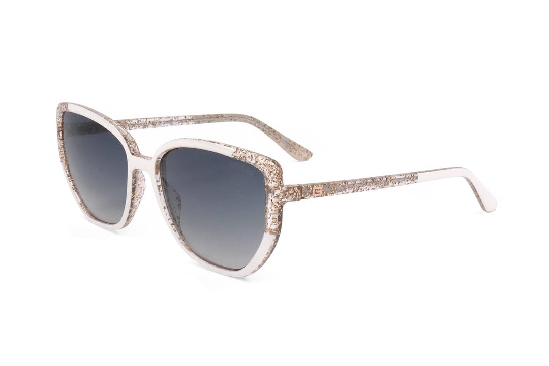 White cat-eye sunglasses with gold flecks and gradient dark lenses on neutral background