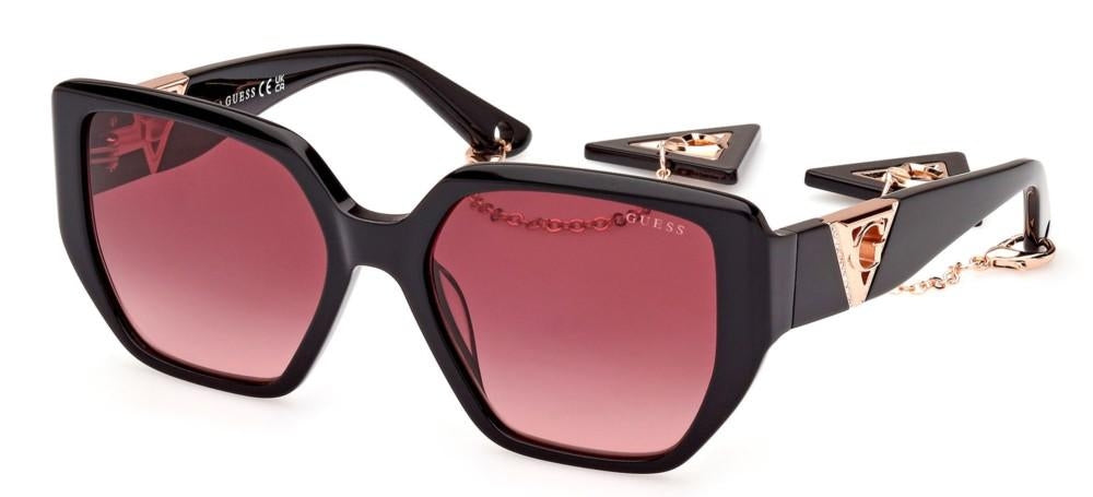 Black oversized square sunglasses with pink gradient lenses, rose gold accents and chain-detail temples