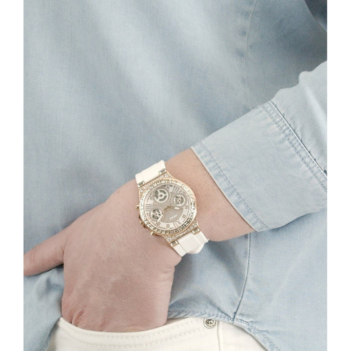 Rose gold chronograph wristwatch on white dial, crystal accents, silicone strap, luxury finish