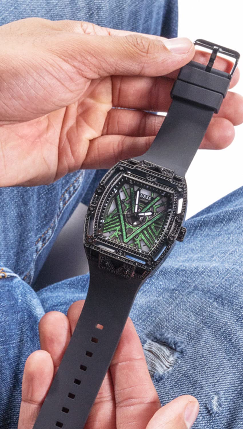 Unisex black watch with crystal-set case, geometric black dial and green accents, silicone strap