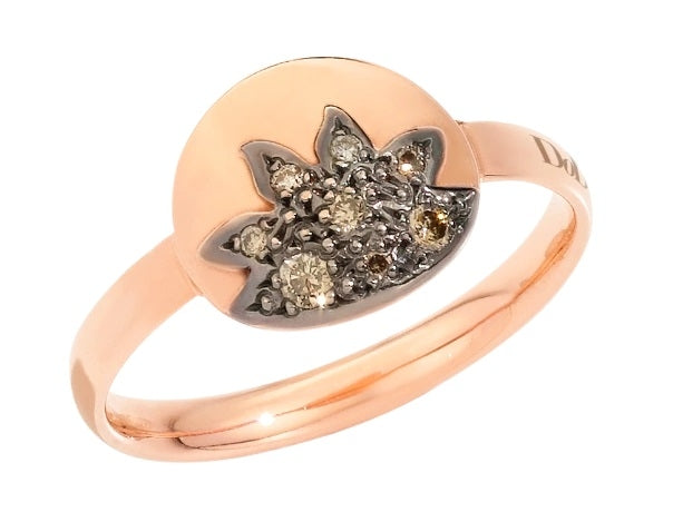 Rose gold fashion ring with small decorative gemstones and polished shine on neutral background