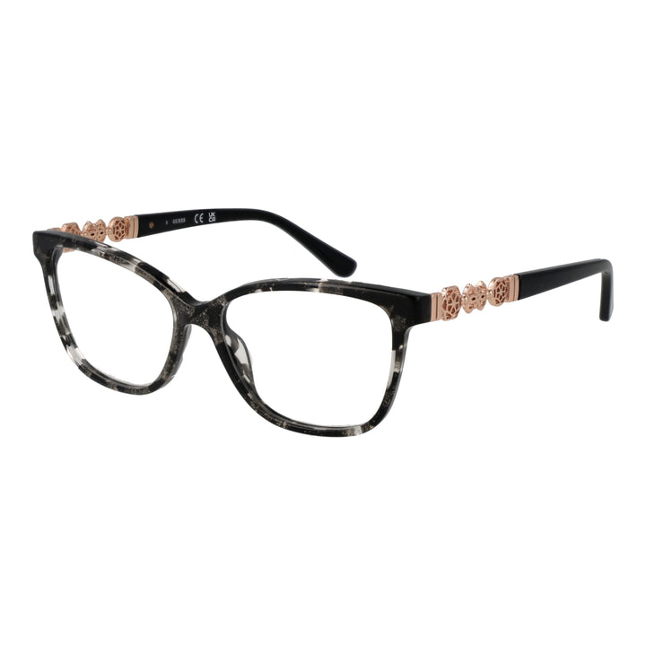 Black speckled cat-eye eyeglasses with rose-gold floral temple accents on white background